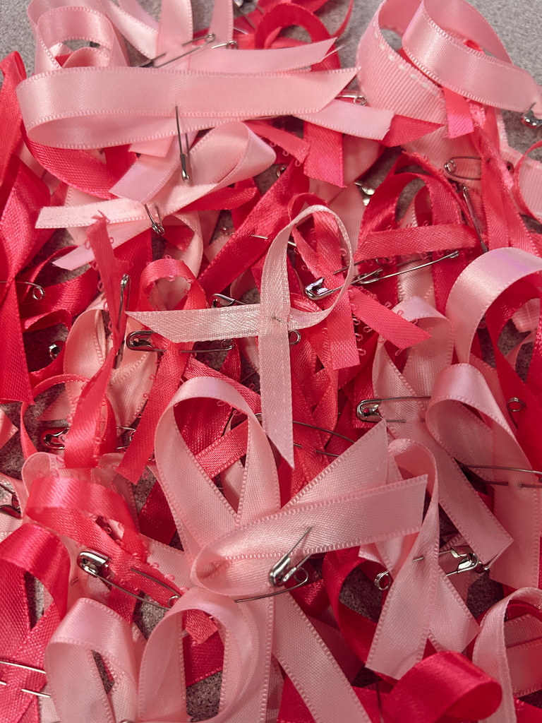 Pile of different hued pink ribbons.